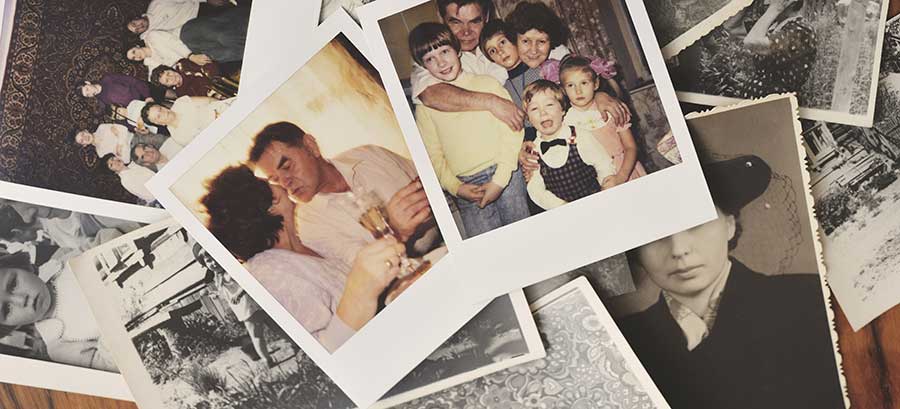 Old polaroid photos scattered on a table